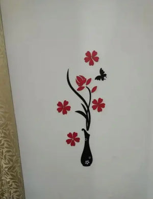 Decorative wall sticker with red flowers and a black vase on a white background