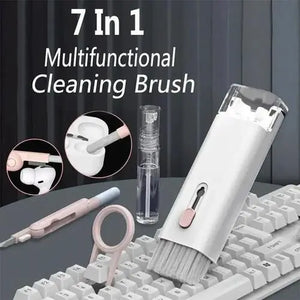 7-in-1 multifunctional cleaning brush with various uses on a keyboard.