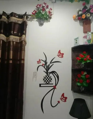 Decorative wall with floral arrangements and a wall decal of a plant and butterflies.