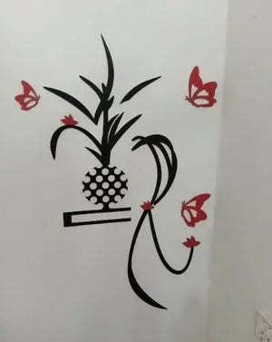 Decorative wall sticker with a pineapple and butterflies on a white wall.