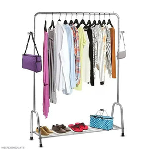 Clothing rack with clothes, shoes, and bags on a white background
