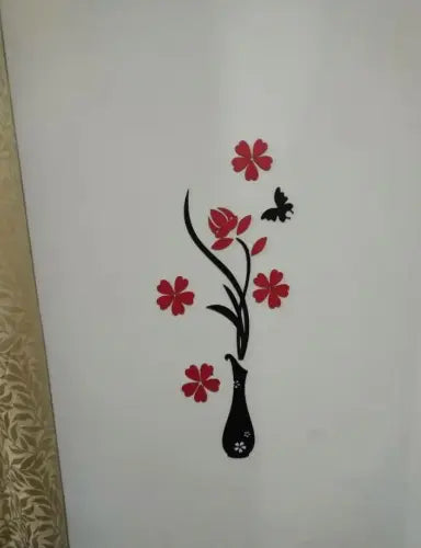 Decorative wall sticker with red flowers and a black vase on a white background