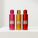 Three BlackBerry essential oil spray bottles lined up on a white surface against a white background. The left bottle is pink with a magenta cap and a geometric pattern, labeled 'PINK'.
