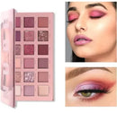 Makeup palette with color swatches and a woman wearing pink eyeshadow.