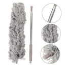 Gray feather duster with close-up details on a white background