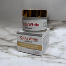 Gluta White skin whitening cream jar and box on a marble surface