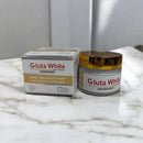 Gluta White skin whitening cream jar and box on a marble surface