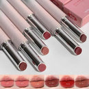 Set of lipsticks with visible shades on a light background