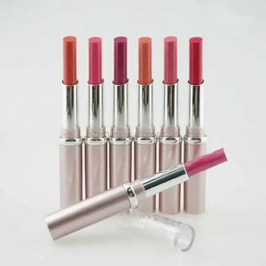 Set of lipsticks with pink and red shades on a white background