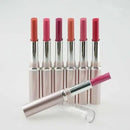 Set of lipsticks with pink and red shades on a white background